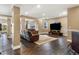 Finished basement with exercise equipment, bar, TV, and comfortable leather seating at 931 Forest View Rd, Monument, CO 80132