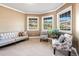 Cozy living room with a comfortable seating arrangement and large windows with mountain views at 931 Forest View Rd, Monument, CO 80132