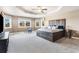 Spacious main bedroom with decorative ceiling, windows, and a unique wood bed frame at 931 Forest View Rd, Monument, CO 80132