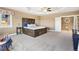 A large main bedroom with tray ceilings and a unique wood bed frame at 931 Forest View Rd, Monument, CO 80132