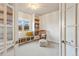Home office featuring a built-in bookcase and bench seat at 931 Forest View Rd, Monument, CO 80132