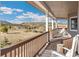 Relaxing porch view with white rocking chairs, scenic landscapes, and a cozy atmosphere at 931 Forest View Rd, Monument, CO 80132