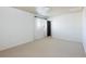 Neutral bedroom features neutral carpet, one window, and a black door at 17853 W 77Th Ln, Arvada, CO 80007