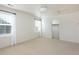 Bright bedroom featuring neutral carpet, two windows and a closet at 17853 W 77Th Ln, Arvada, CO 80007