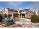 Inviting two-story home with a three-car garage and a well-maintained front yard at 17853 W 77Th Ln, Arvada, CO 80007