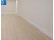 Light hardwood floors extend through a bright hallway, and a window at 17853 W 77Th Ln, Arvada, CO 80007