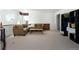 Spacious upstairs living room with neutral carpet, cozy seating, and natural light at 17853 W 77Th Ln, Arvada, CO 80007