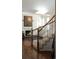Hallway view of a contemporary living space featuring a fireplace and light-filled windows at 17853 W 77Th Ln, Arvada, CO 80007
