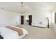 Bright main bedroom with a seating area and large windows at 17853 W 77Th Ln, Arvada, CO 80007