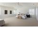 Spacious main bedroom with vaulted ceilings, white walls and modern ceiling fan at 17853 W 77Th Ln, Arvada, CO 80007