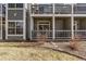 Backyard with gray siding walls, a patio, and a manicured yard at 7481 Singing Hills Dr, Boulder, CO 80301