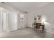 Neutral bedroom featuring an open closet, a woven chair and a desk with decor at 7481 Singing Hills Dr, Boulder, CO 80301