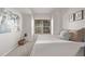 This bedroom offers a tranquil space with natural light and soothing decor at 7481 Singing Hills Dr, Boulder, CO 80301