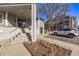 Exterior view with stairs leading up to entrance, parking spots, and gray siding at 7481 Singing Hills Dr, Boulder, CO 80301