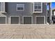 Exterior shot of multiple garage units with gray doors and unit numbers displayed at 7481 Singing Hills Dr, Boulder, CO 80301