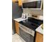 The kitchen showcases a stainless steel stove, microwave and plentiful counter space at 7481 Singing Hills Dr, Boulder, CO 80301