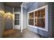 Outdoor patio with white door and large window allows plenty of natural light at 7481 Singing Hills Dr, Boulder, CO 80301