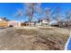 Spacious backyard with a shed, trees, and fencing, offering plenty of space at 280 Jupiter Dr, Lone Tree, CO 80124