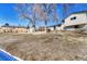 Large backyard with lawn, shed, mature trees, and a privacy fence at 280 Jupiter Dr, Lone Tree, CO 80124
