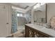 Well-lit bathroom with a shower-tub combo, vanity, and modern fixtures at 280 Jupiter Dr, Lone Tree, CO 80124