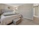 Cozy bedroom with neutral colors, carpet flooring, and a comfortable upholstered bed at 280 Jupiter Dr, Lone Tree, CO 80124