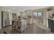 Modern kitchen with stainless steel appliances, a center island, and access to the outdoor patio at 280 Jupiter Dr, Lone Tree, CO 80124