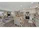 This is a contemporary kitchen boasting an island and modern stainless steel appliances at 280 Jupiter Dr, Lone Tree, CO 80124