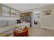 Cozy living room with comfortable seating, a bookcase and decoratively adorned walls at 280 Jupiter Dr, Lone Tree, CO 80124