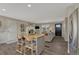 Open-concept living space with a center island, hardwood floors, fireplace, and comfortable seating area at 280 Jupiter Dr, Lone Tree, CO 80124