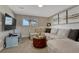 Well-lit living room featuring comfortable seating, a TV, and decorative wall art at 280 Jupiter Dr, Lone Tree, CO 80124