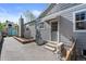 Charming backyard with brick patio, small lawn and well-maintained garden area at 2385 S Marion St, Denver, CO 80210