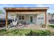 Inviting covered patio with string lights, seating, and a charming hammock at 2385 S Marion St, Denver, CO 80210