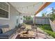 Inviting covered patio with string lights, seating, and a charming hammock at 2385 S Marion St, Denver, CO 80210