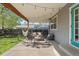 Inviting covered patio with string lights, seating, and a charming hammock at 2385 S Marion St, Denver, CO 80210