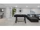 Finished basement featuring a foosball table, and a cozy seating area at 2385 S Marion St, Denver, CO 80210