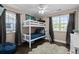 Charming bedroom featuring a bunk bed, plush rug and plenty of natural light at 2385 S Marion St, Denver, CO 80210