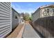 Well-maintained side yard with brick pavers and mature landscaping at 2385 S Marion St, Denver, CO 80210