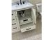 Bathroom showcasing under-sink storage, tile floors, and contemporary fixtures at 942 S Walden St # 206, Aurora, CO 80017