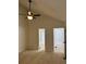 Bright bedroom showcasing neutral walls, ceiling fan, and ensuite access at 942 S Walden St # 206, Aurora, CO 80017