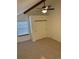 Inviting bedroom features closet, ceiling fan, and sun-filled window at 942 S Walden St # 206, Aurora, CO 80017