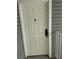 The front door of the condo is white with a peephole and electronic lock at 942 S Walden St # 206, Aurora, CO 80017