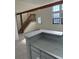 Living room features a kitchen breakfast bar, vaulted ceiling, and staircase at 942 S Walden St # 206, Aurora, CO 80017