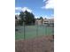 Community tennis courts surrounded by mature trees and low maintenance landscaping at 942 S Walden St # 206, Aurora, CO 80017