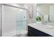 Modern bathroom featuring a glass-enclosed shower and sleek vanity at 12777 Ulster St, Thornton, CO 80602