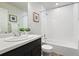 Clean bathroom featuring a tub and shower combination, a modern vanity, and neutral finishes at 12777 Ulster St, Thornton, CO 80602