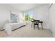 Well-lit bedroom with a desk, chair, and view of the neighborhood at 12777 Ulster St, Thornton, CO 80602