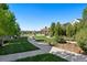 Picturesque community park with lush green space, walking paths, and a shaded gazebo at 12777 Ulster St, Thornton, CO 80602