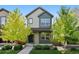 Charming two-story home with green and grey siding and a well-manicured front yard at 12777 Ulster St, Thornton, CO 80602