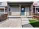 Inviting front entrance with a covered porch, well-manicured landscaping, and a charming front door at 12777 Ulster St, Thornton, CO 80602