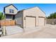 Detached two-car garage with concrete driveway, complementing the home's exterior at 12777 Ulster St, Thornton, CO 80602